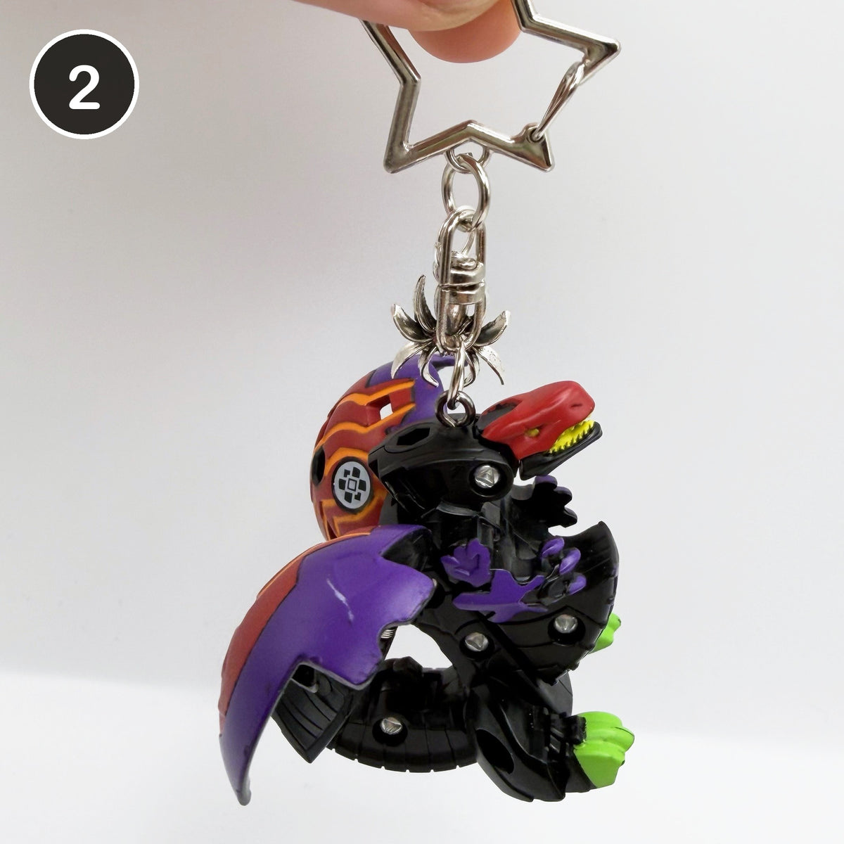 #2 Witching Brawler upcycled Bakugan keychain, opened