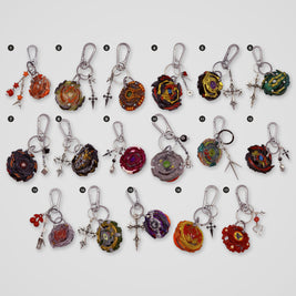 Red & Gold upcycled Beyblade keychains, all designs