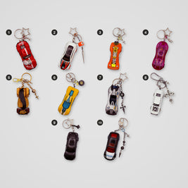 Red & Chrome upcycled Hot Wheels keychains, all designs